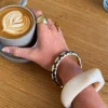 Arna armbånd med mønster - Sort/guld